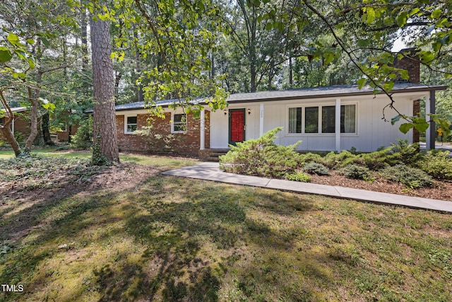 700 Tinkerbell Rd, Chapel Hill, NC 27517 - single story home featuring a front yard and a chimney