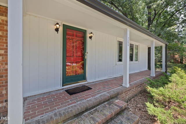 700 Tinkerbell Rd, Chapel Hill, NC 27517 - entrance to property featuring covered porch and brick siding
