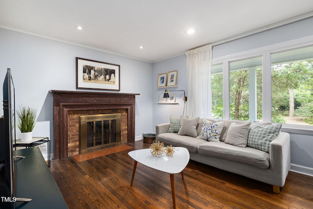 700 Tinkerbell Rd, Chapel Hill, NC 27517 - living area featuring wood finished floors, a brick fireplace, recessed lighting, and crown molding