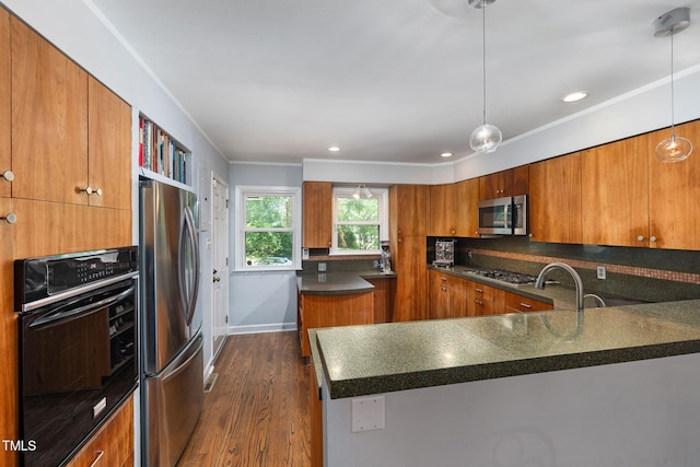 700 Tinkerbell Rd, Chapel Hill, NC 27517 - kitchen with stainless steel appliances, brown cabinets, dark countertops, dark wood-type flooring, and ornamental molding