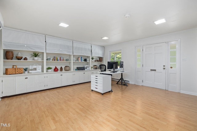 700 Tinkerbell Rd, Chapel Hill, NC 27517 - office with light wood finished floors and a baseboard heating unit