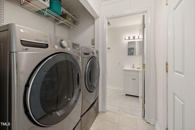 700 Tinkerbell Rd, Chapel Hill, NC 27517 - laundry room with washing machine and dryer and light tile patterned floors
