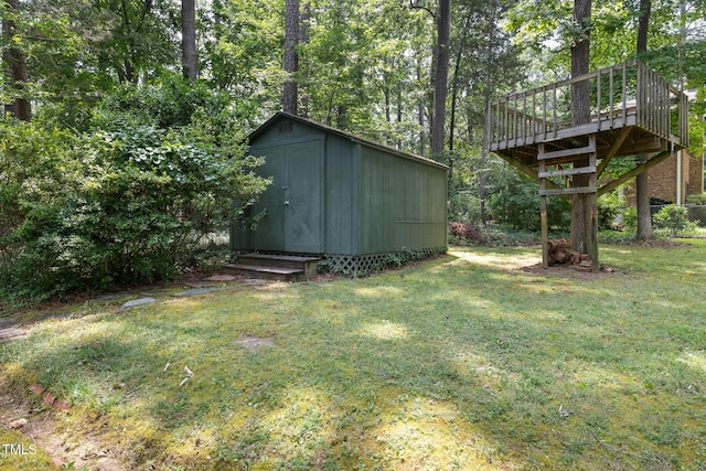 700 Tinkerbell Rd, Chapel Hill, NC 27517 - view of grassy yard with a storage unit and a wooden deck