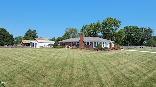 10781 US-158, Reidsville, NC 27320 - view of front of property with a chimney, an outbuilding, and brick siding