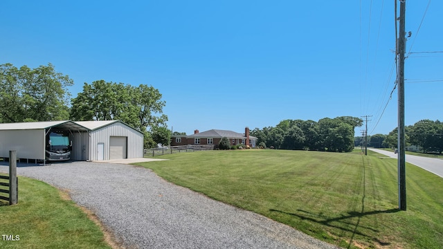 10781 US-158, Reidsville, NC 27320 - view of yard with a detached garage, an outdoor structure, and gravel driveway