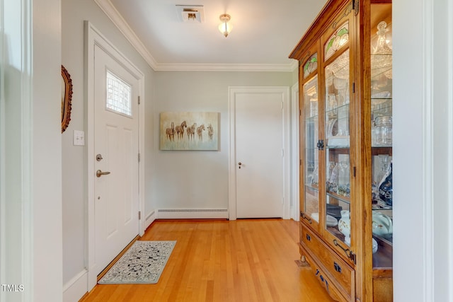 10781 US-158, Reidsville, NC 27320 - entrance foyer with light wood-style flooring, crown molding, and a baseboard radiator