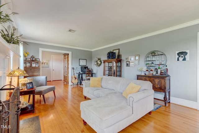 10781 US-158, Reidsville, NC 27320 - living room with light wood-type flooring and crown molding