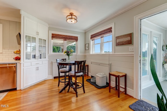 10781 US-158, Reidsville, NC 27320 - dining area featuring light wood-style flooring, ornamental molding, and a wainscoted wall