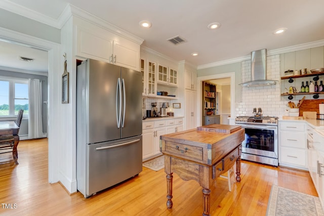 10781 US-158, Reidsville, NC 27320 - kitchen with stainless steel appliances, wall chimney range hood, open shelves, backsplash, and ornamental molding