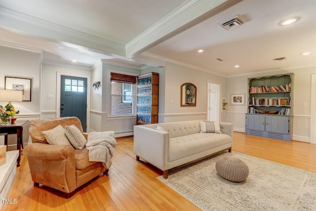 10781 US-158, Reidsville, NC 27320 - living area featuring ornamental molding, light wood finished floors, a wainscoted wall, a decorative wall, and recessed lighting