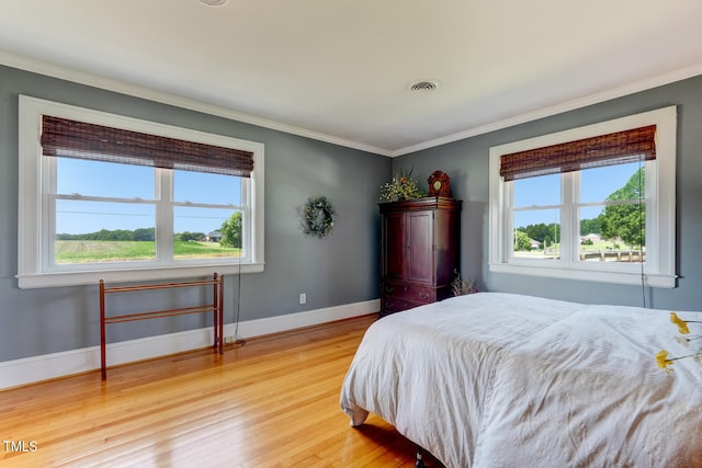 10781 US-158, Reidsville, NC 27320 - bedroom featuring light wood-style floors and ornamental molding