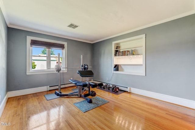 10781 US-158, Reidsville, NC 27320 - exercise room with wood-type flooring, baseboard heating, built in features, and crown molding