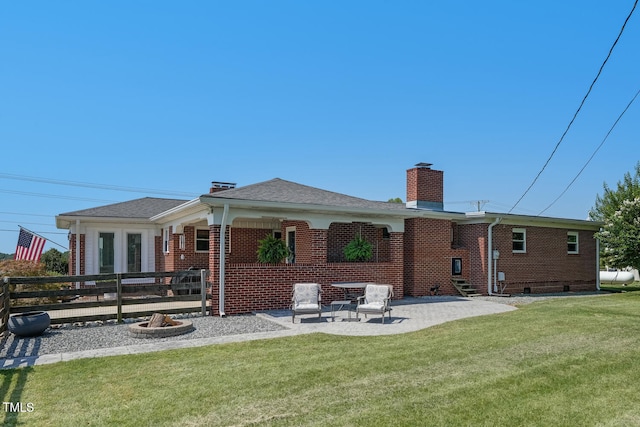 10781 US-158, Reidsville, NC 27320 - rear view of property with brick siding, a chimney, a patio area, and a lawn