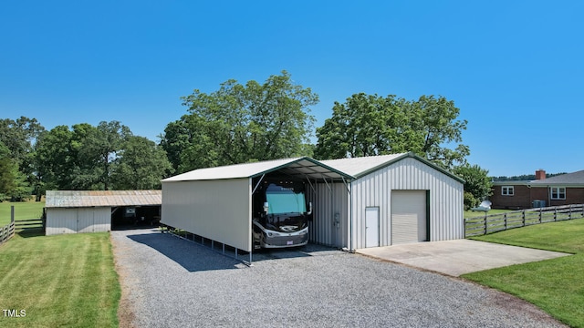 10781 US-158, Reidsville, NC 27320 - garage with gravel driveway, a detached garage, and a detached carport