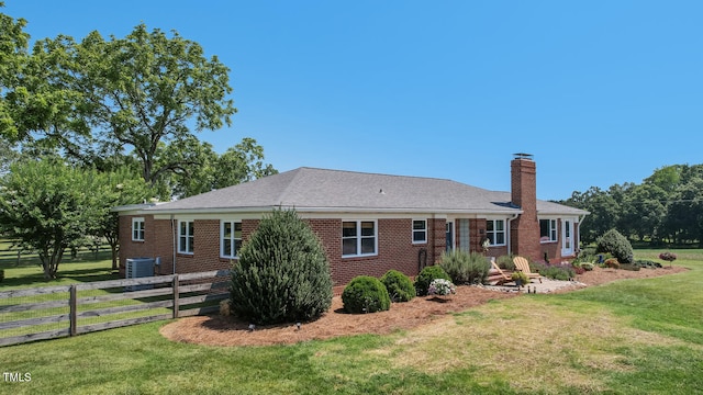 10781 US-158, Reidsville, NC 27320 - rear view of property featuring a chimney and brick siding