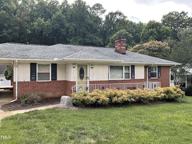 5924 Woodcrest Dr, Raleigh, NC 27603 - ranch-style house featuring brick siding, a front lawn, and roof with shingles