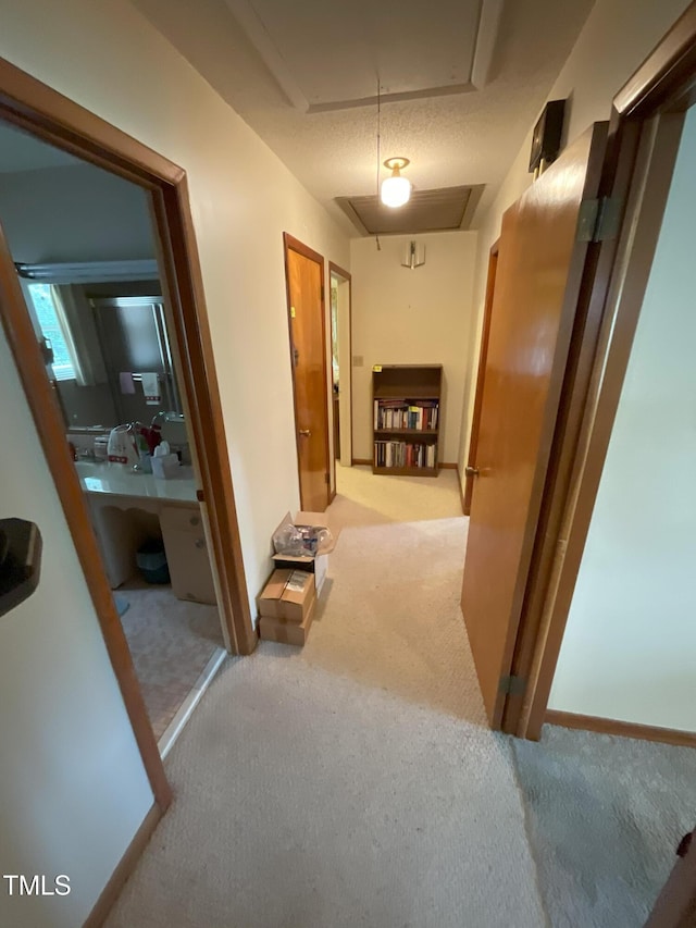 5924 Woodcrest Dr, Raleigh, NC 27603 - hallway featuring carpet flooring and attic access