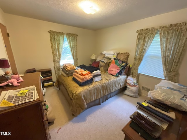 5924 Woodcrest Dr, Raleigh, NC 27603 - carpeted bedroom with a textured ceiling