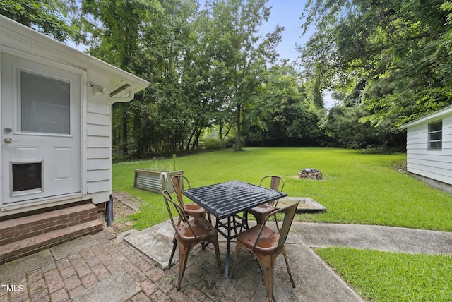 7 Meadowbrook Ave, Durham, NC 27712 - view of patio with outdoor dining space, entry steps, and view of wooded area