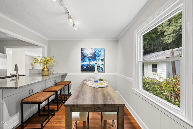 7 Meadowbrook Ave, Durham, NC 27712 - dining room featuring wood finished floors, track lighting, and crown molding