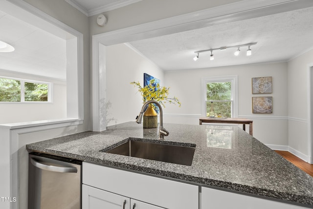 7 Meadowbrook Ave, Durham, NC 27712 - kitchen featuring stainless steel dishwasher, white cabinets, dark stone counters, plenty of natural light, and ornamental molding