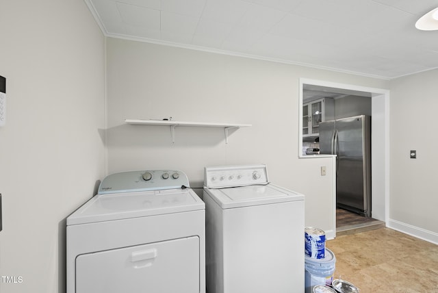7 Meadowbrook Ave, Durham, NC 27712 - laundry room featuring washer and clothes dryer and ornamental molding