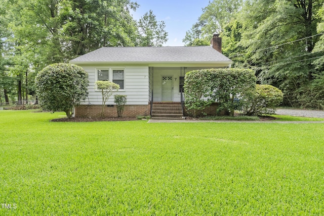 7 Meadowbrook Ave, Durham, NC 27712 - view of front of property featuring a front yard, a chimney, and a porch