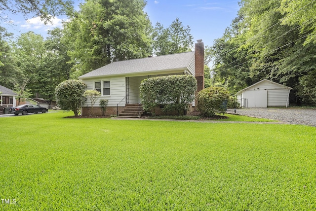 7 Meadowbrook Ave, Durham, NC 27712 - view of front of home with a front lawn, a chimney, an outdoor structure, and a shingled roof
