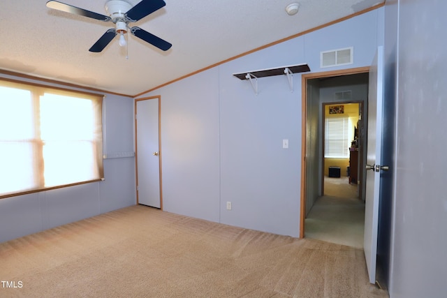 69 Laurel Meadows Ct, Burlington, NC 27217 - empty room with carpet, vaulted ceiling, a smoke detector, a ceiling fan, and ornamental molding