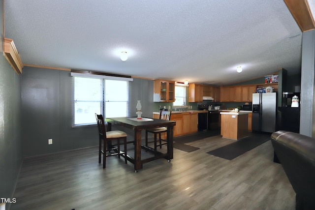 69 Laurel Meadows Ct, Burlington, NC 27217 - dining room with a textured ceiling, wood finished floors, and lofted ceiling