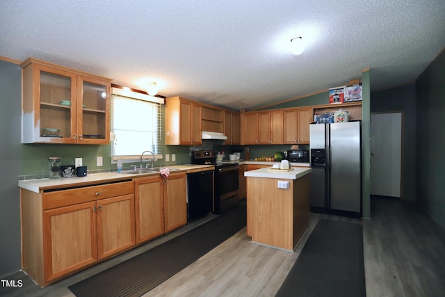 69 Laurel Meadows Ct, Burlington, NC 27217 - kitchen with black appliances, under cabinet range hood, light wood-style flooring, a textured ceiling, and light countertops