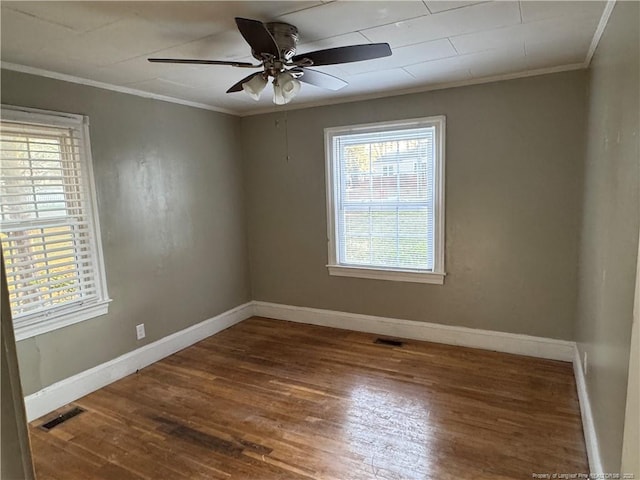 116 N Wright St, Raeford, NC 28376 - empty room with ornamental molding, wood finished floors, and ceiling fan