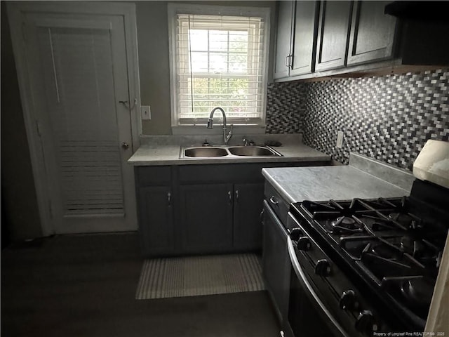 116 N Wright St, Raeford, NC 28376 - kitchen featuring stainless steel gas range, light countertops, tasteful backsplash, and extractor fan