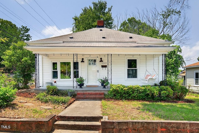 1001 Lancaster St, Durham, NC 27701 - view of front of property with a chimney, covered porch, and a shingled roof
