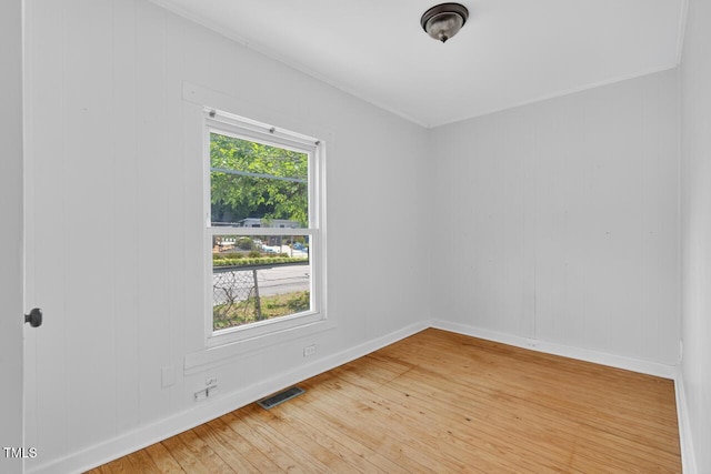 1001 Lancaster St, Durham, NC 27701 - empty room with light wood finished floors and crown molding