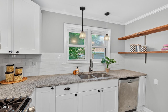 1001 Lancaster St, Durham, NC 27701 - kitchen with stainless steel appliances, backsplash, crown molding, white cabinetry, and pendant lighting