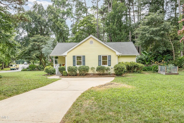 6025 Tarnhour Ct, Raleigh, NC 27612 - view of front of home featuring a shingled roof, a front yard, concrete driveway, and view of scattered trees