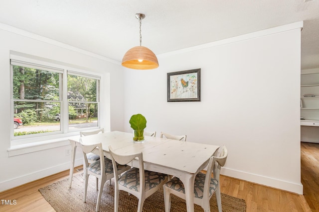 6025 Tarnhour Ct, Raleigh, NC 27612 - dining area with crown molding and light wood-type flooring