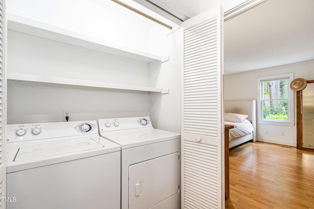 6025 Tarnhour Ct, Raleigh, NC 27612 - laundry room featuring washer and dryer and light wood-style floors