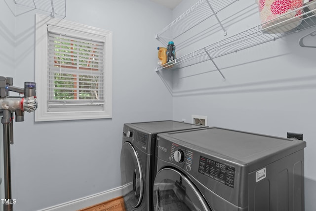 511 Scotts Ridge Trl, Apex, NC 27502 - laundry area with washing machine and clothes dryer and baseboards