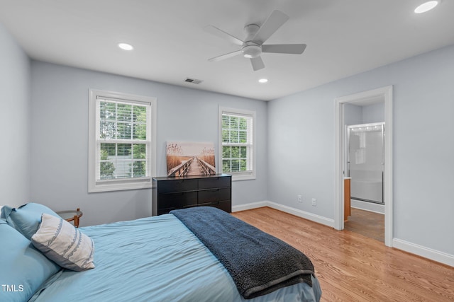 511 Scotts Ridge Trl, Apex, NC 27502 - bedroom with multiple windows, light wood-style floors, recessed lighting, a ceiling fan, and ensuite bathroom