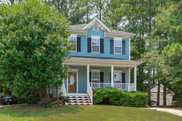 511 Scotts Ridge Trl, Apex, NC 27502 - view of front of house with a porch and a front lawn