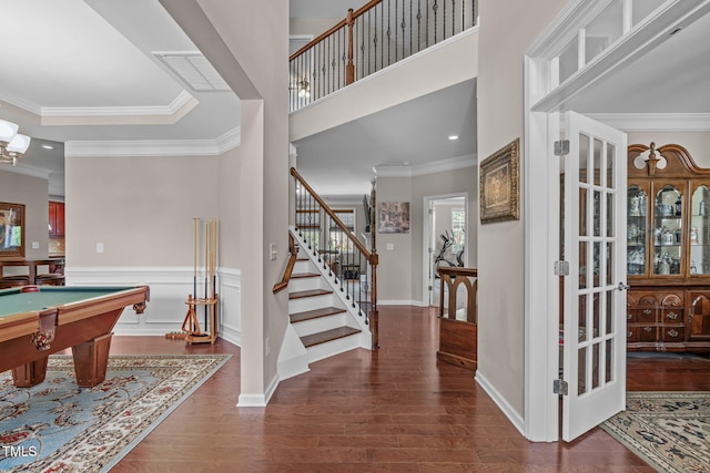 1950 Firenza Dr, Apex, NC 27502 - foyer with wood finished floors, crown molding, stairway, pool table, and a towering ceiling