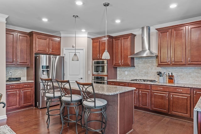 1950 Firenza Dr, Apex, NC 27502 - kitchen with appliances with stainless steel finishes, wall chimney exhaust hood, ornamental molding, a center island, and a kitchen bar