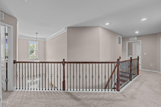 1950 Firenza Dr, Apex, NC 27502 - hallway with carpet floors, an upstairs landing, ornamental molding, and recessed lighting