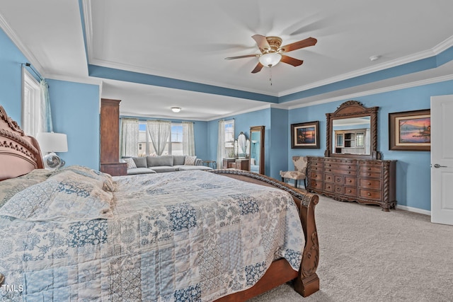 1950 Firenza Dr, Apex, NC 27502 - carpeted bedroom featuring ornamental molding, a tray ceiling, and a ceiling fan