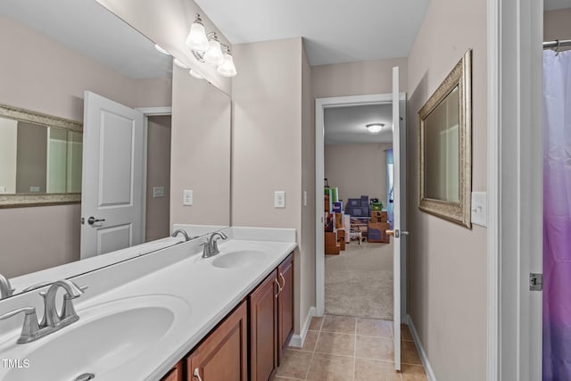 1950 Firenza Dr, Apex, NC 27502 - bathroom featuring double vanity and tile patterned flooring