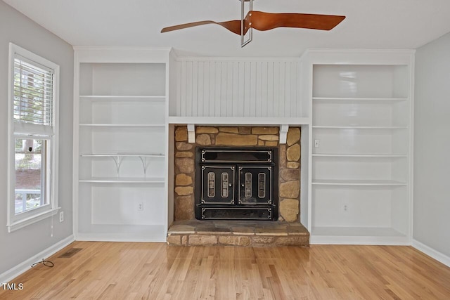 3104 Braywood Ct, Apex, NC 27539 - detailed view of wood finished floors, a ceiling fan, and built in features