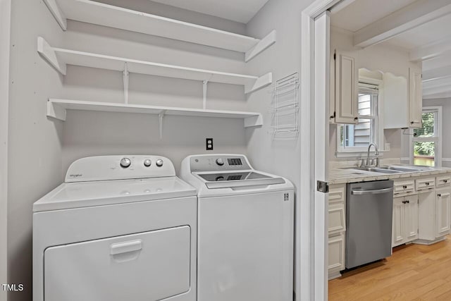 3104 Braywood Ct, Apex, NC 27539 - laundry area featuring washing machine and clothes dryer and light wood-type flooring