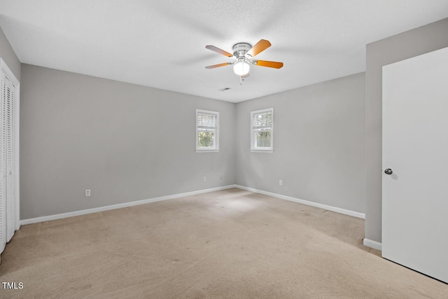 3104 Braywood Ct, Apex, NC 27539 - unfurnished bedroom with light colored carpet, a ceiling fan, and a closet